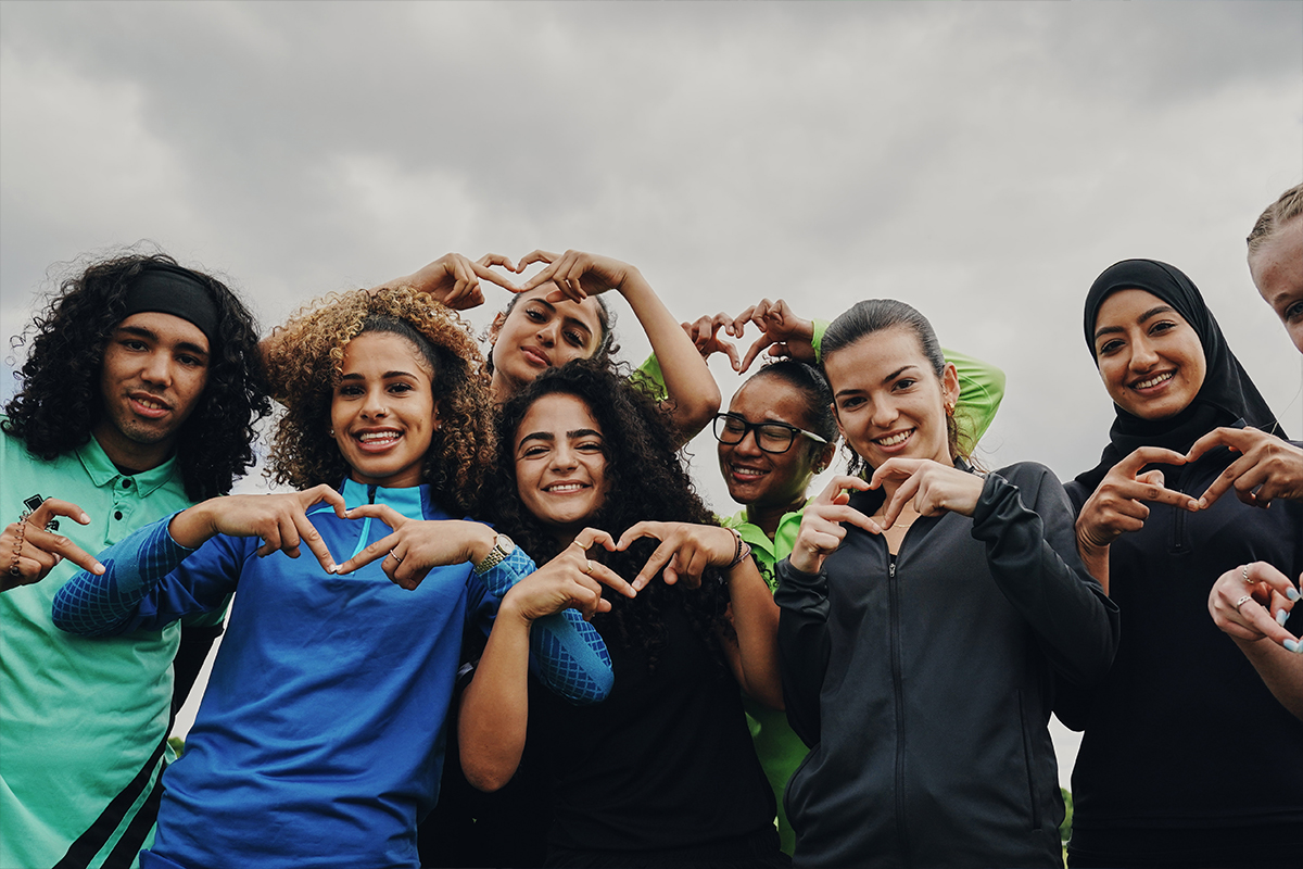 Players making hearts with their hands