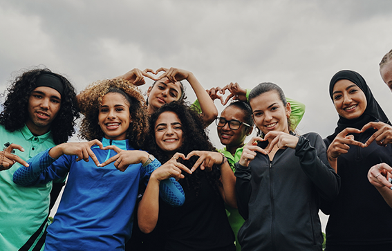 Group of players showing love heart sign